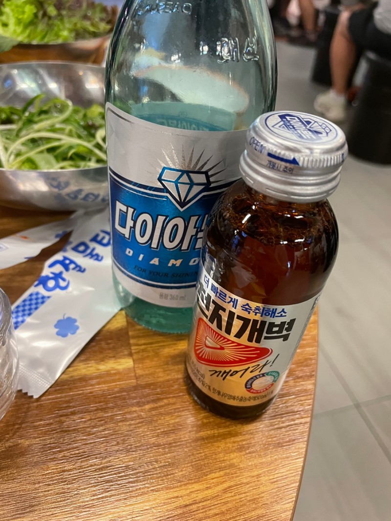 CJGB anti-hangover drink served table-side with soju